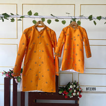 Load image into Gallery viewer, BT2355 Father-Son Twinning Orange Kurta with Purple Pajama Set – Festive Family Outfit
