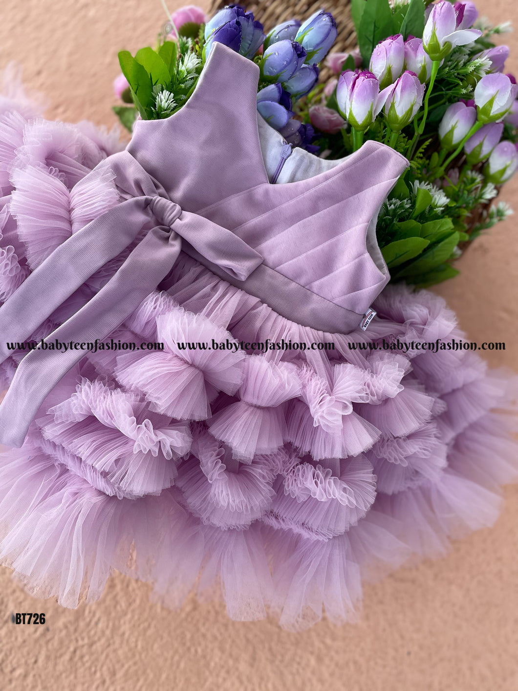 BT726 Premium Partywear Frock In Pastel Lavender Color with Extra Thick Ruffles On Skirting and Bow Highlight On Backsde