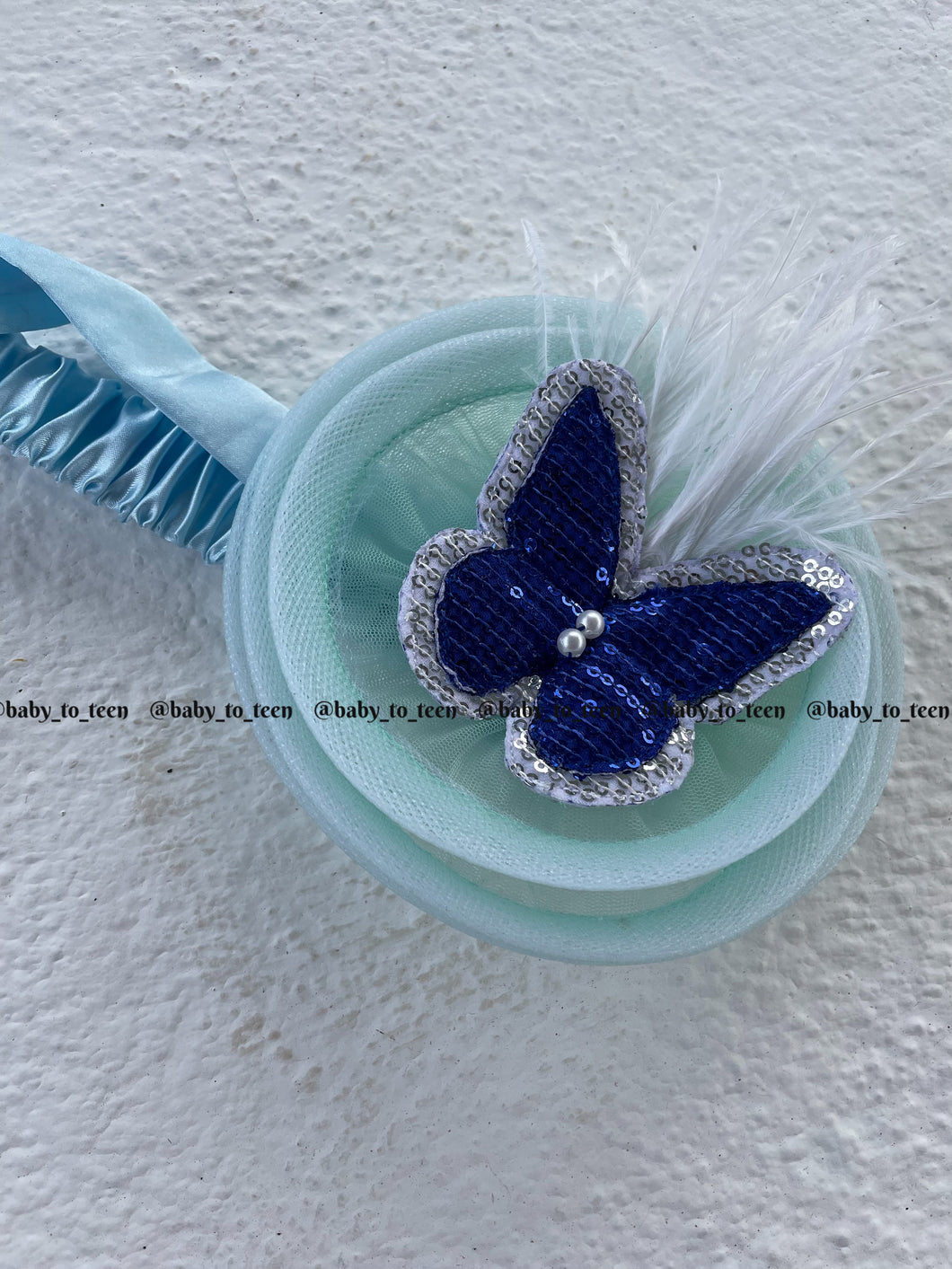 BUTTERFLY WITH FEATHER FASCINATOR
