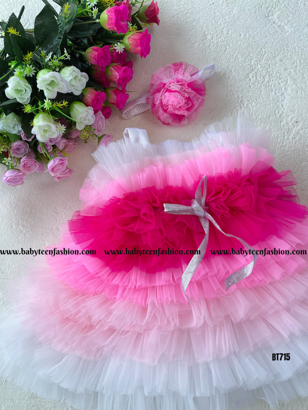 BT715 Multilayered Birthday Frock Done in Shades of Pink with Silver Ribbon Highlight
